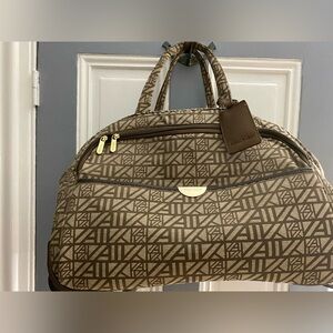 Vintage Anne Klein rolling carry-on/suitcase